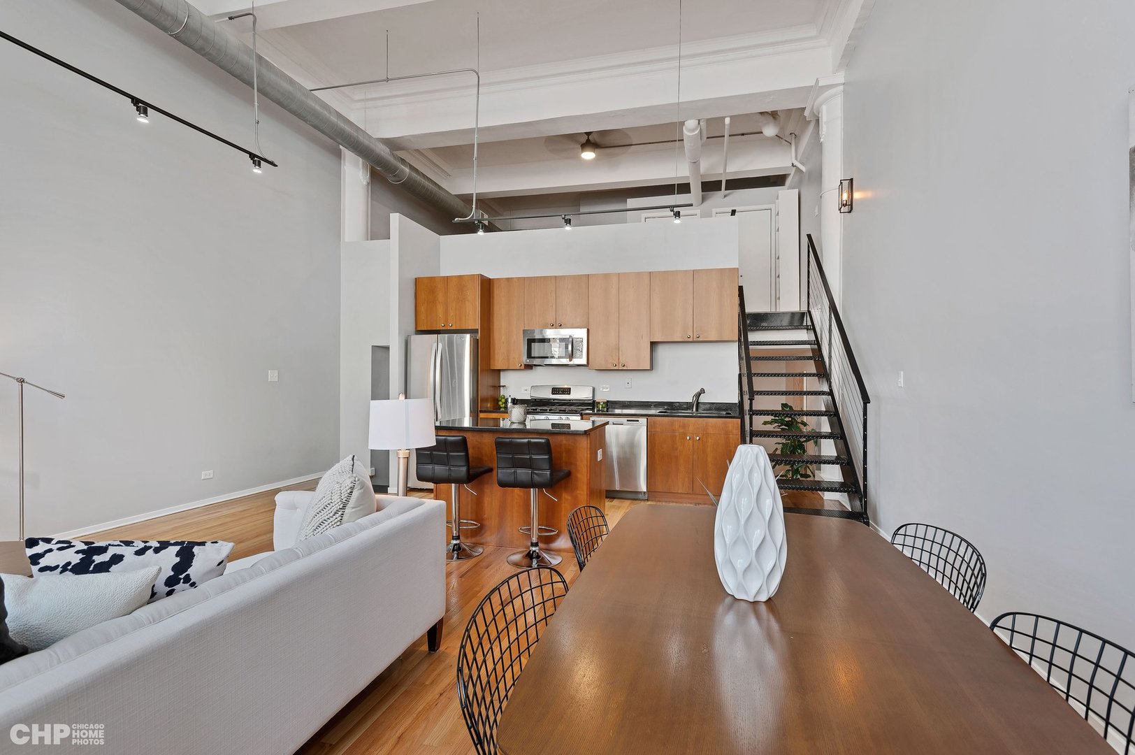 2000 South Michigan Avenue, Unit 107 Chicago, IL 60616 - Photo 7 of 30 a dining room with furniture and wooden floor