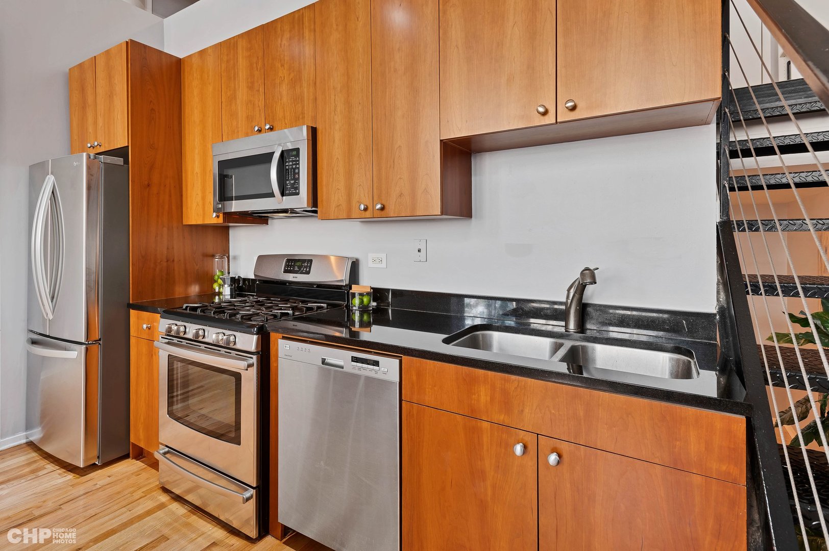 2000 South Michigan Avenue, Unit 107 Chicago, IL 60616 - Photo 9 of 30 a kitchen with stainless steel appliances granite countertop a sink stove and refrigerator