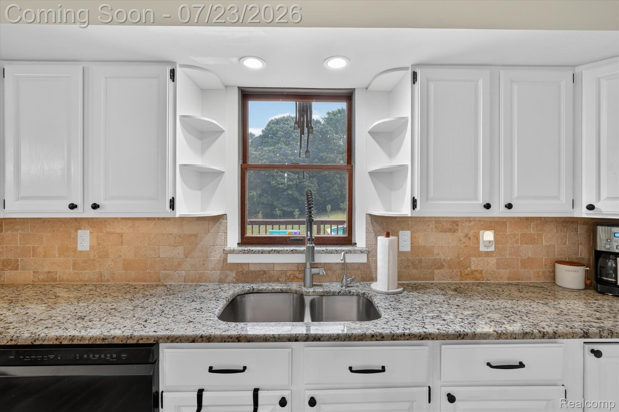 2795 Bird Road Ortonville, MI 48462 - Photo 17 of 62 Kitchen featuring white shaker-style cabinetry, granite countertops, and a stone tile backsplash
