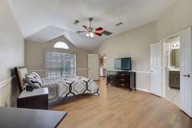 a living room with furniture couches and a flat screen tv