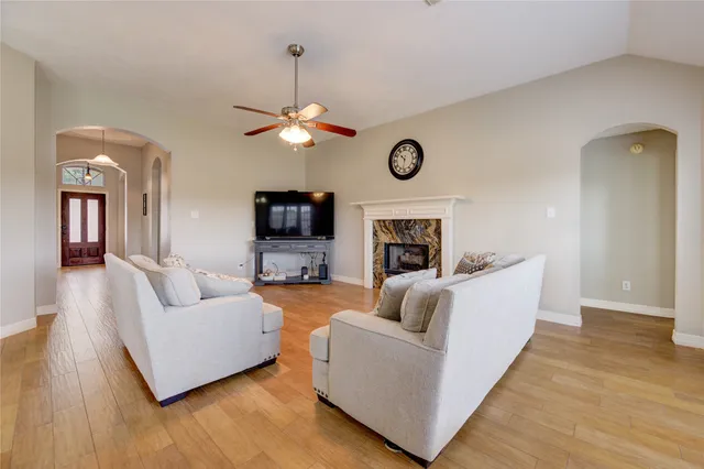 a living room with furniture and a flat screen tv