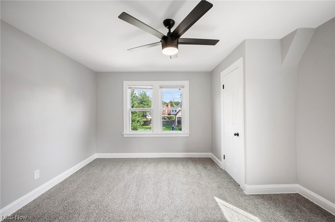 1022 Englewood Road Cleveland, OH 44121 - Photo 27 of 33 Empty room featuring ceiling fan and light carpet