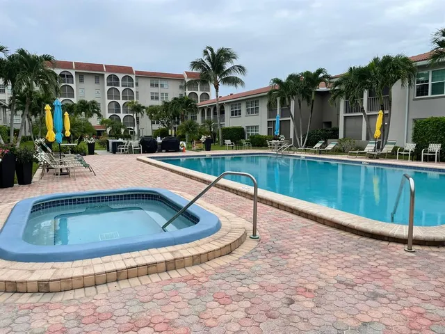 a view of a swimming pool with a patio