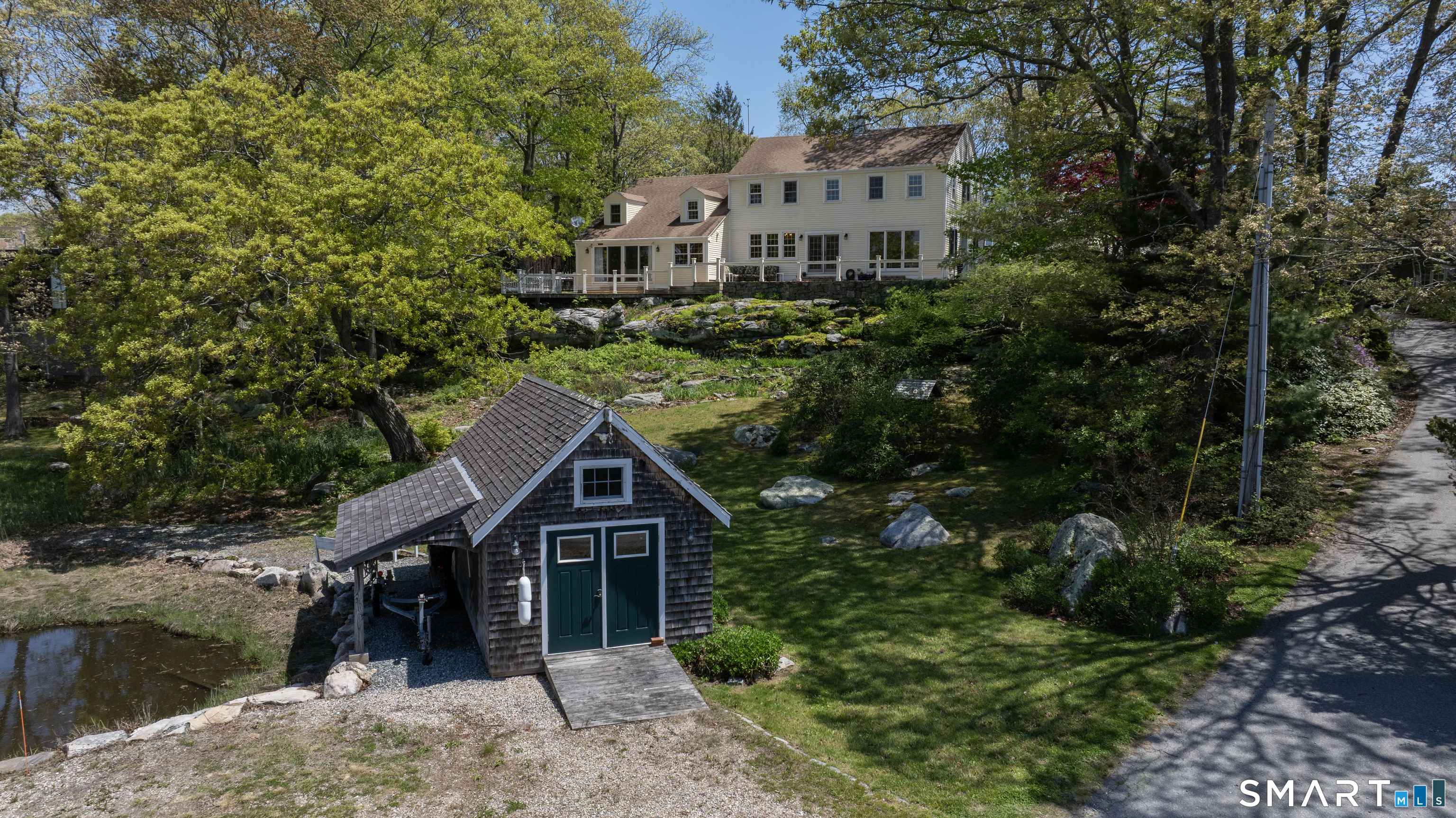 32 Money Point Road Stonington, CT 06355 - Photo 35 of 40 a house with trees in the background