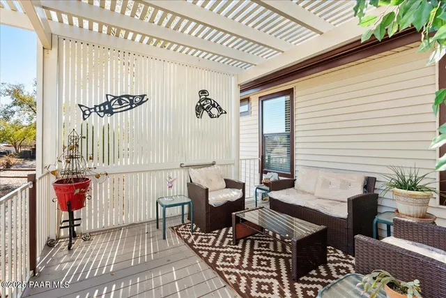 a view of a balcony with furniture