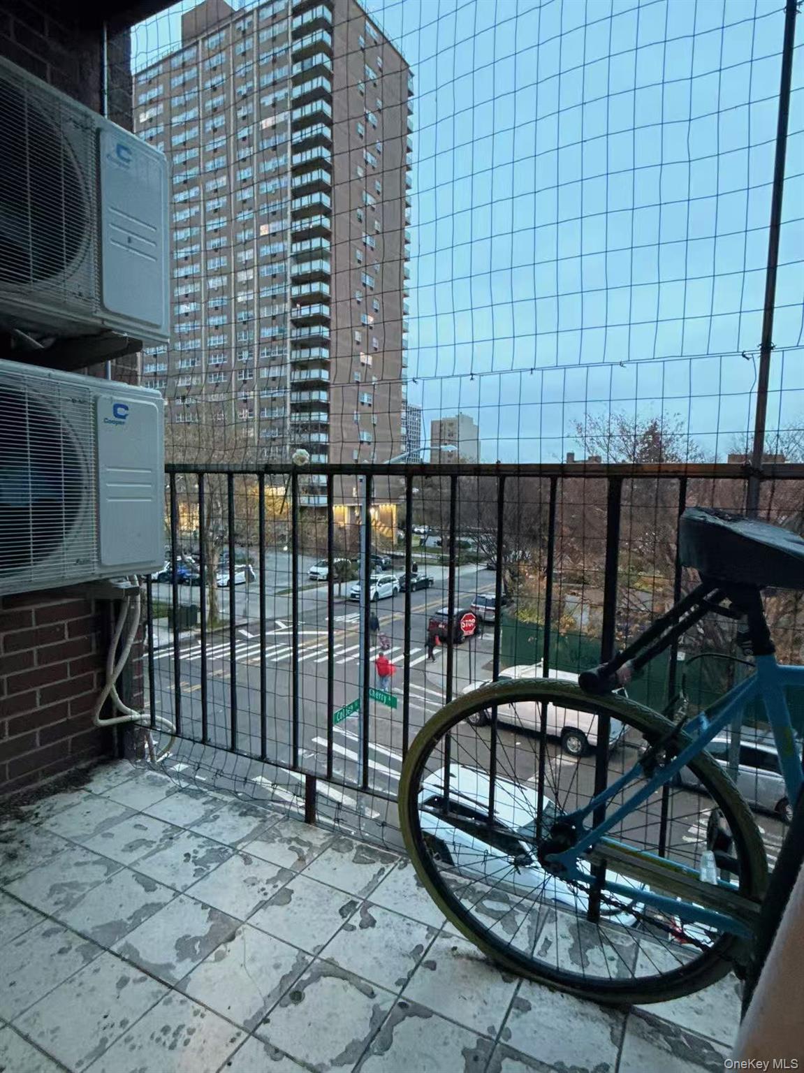4260 Colden Street, Unit 3A Queens, NY 11355 - Photo 11 of 11 a view of a porch with a table and chairs