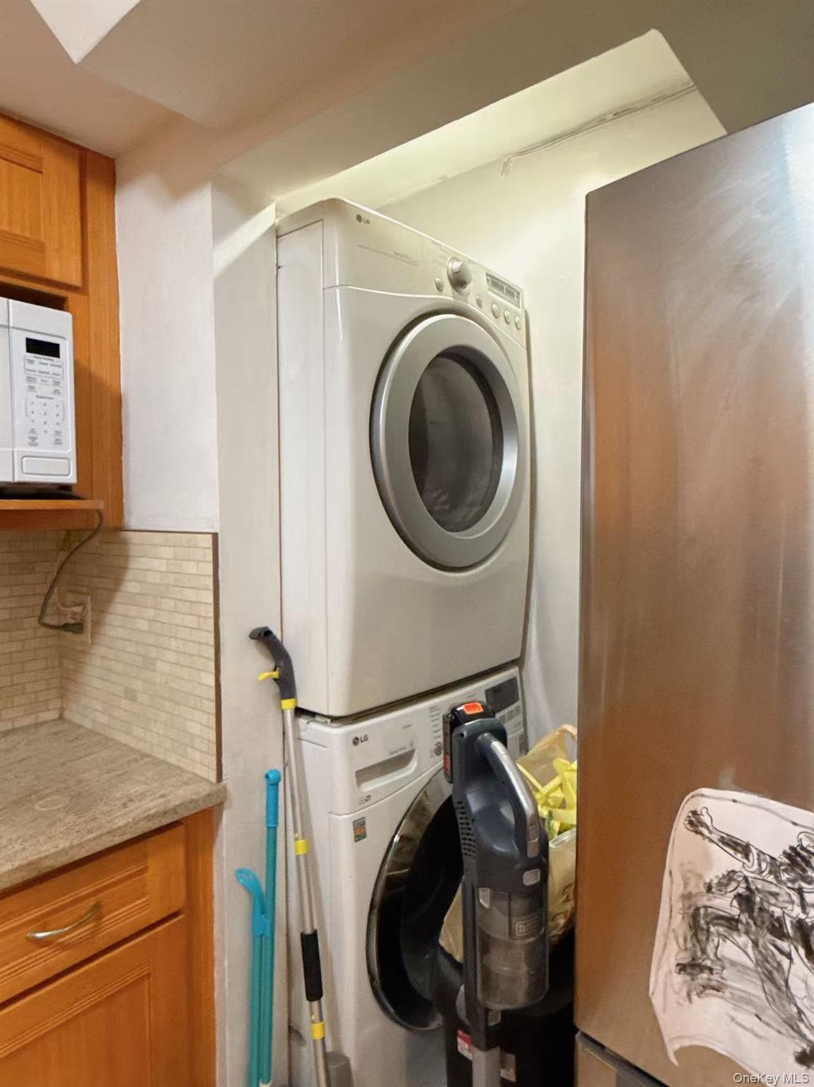 4260 Colden Street, Unit 3A Queens, NY 11355 - Photo 10 of 11 a utility room with dryer and washer