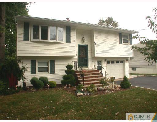 11 Highland Terrace Fords, NJ 08863 - Photo 1 of 6 a front view of a house with a garden