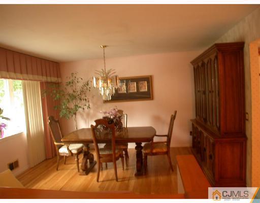 11 Highland Terrace Fords, NJ 08863 - Photo 4 of 6 a view of a dining room with furniture and window