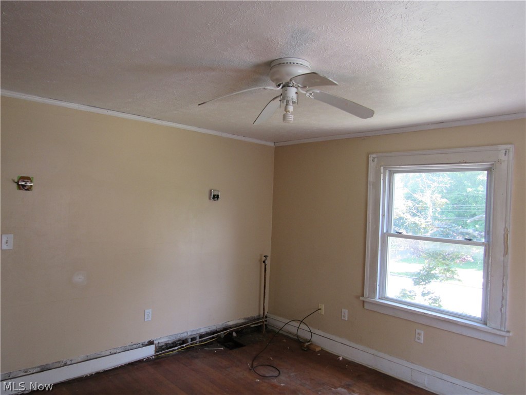 1726 Lee Road Cleveland Heights, OH 44118 - Photo 26 of 36 Windowed room featuring a ceiling fan, baseboard trim, and hardwood flooring