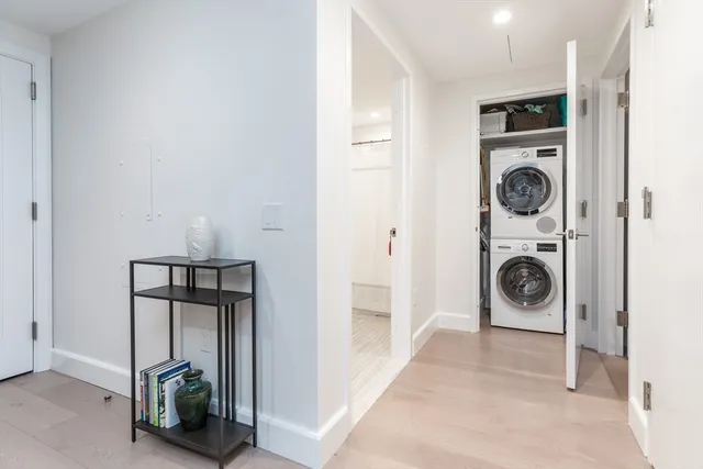 a view of a storage and utility room with washer and dryer