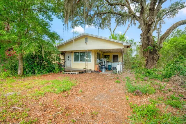 a view of backyard with green space