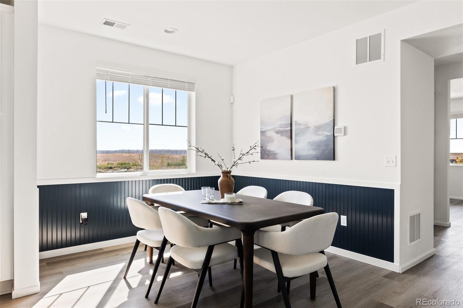9054 Truckee Court Commerce City, CO 80022 - Photo 13 of 49 a view of a dining room with furniture window and outside view