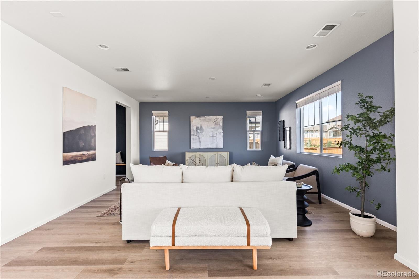 9054 Truckee Court Commerce City, CO 80022 - Photo 17 of 49 a living room with furniture and a large window