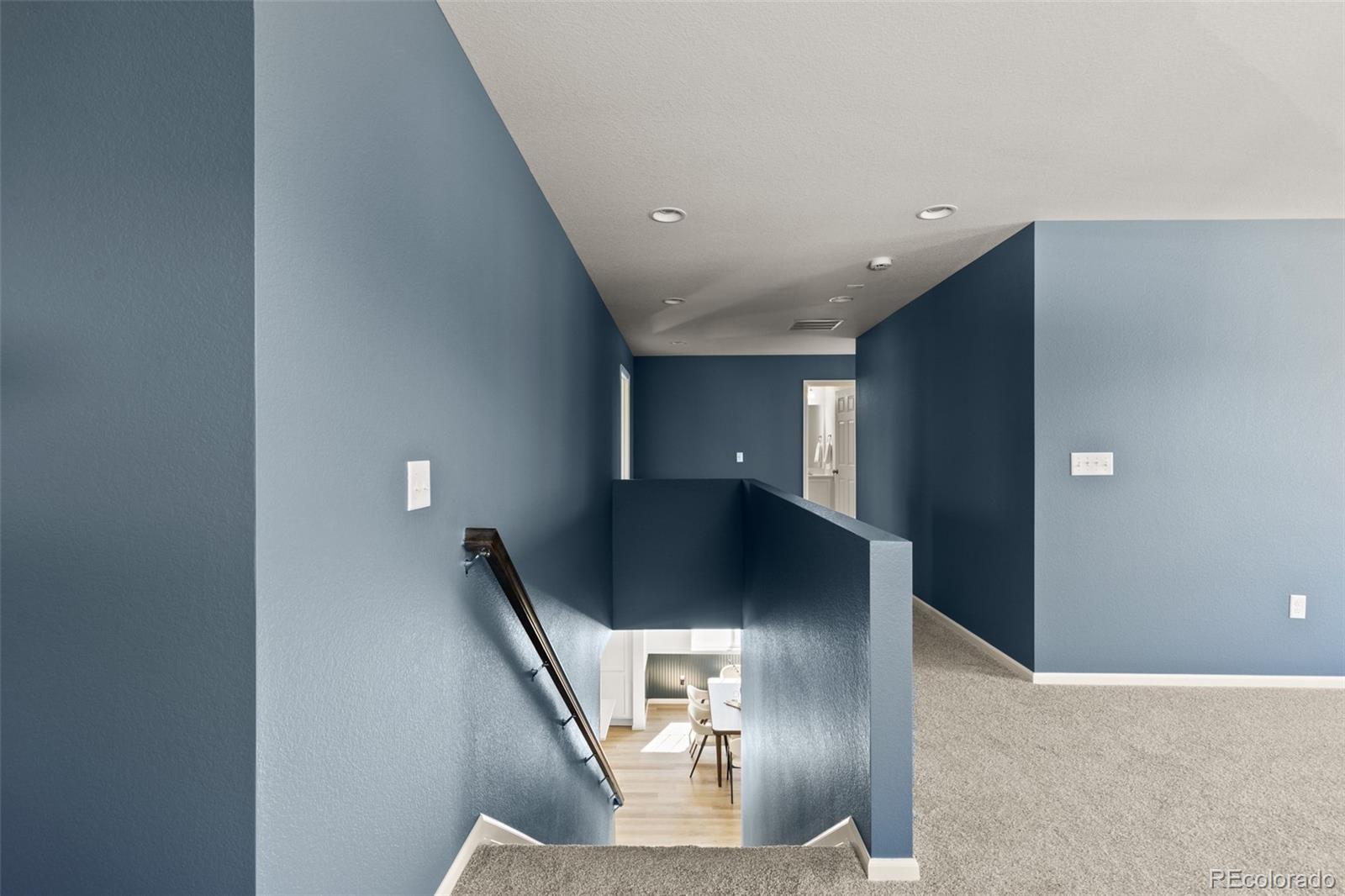 9054 Truckee Court Commerce City, CO 80022 - Photo 34 of 49 a view of an empty room with wooden floor