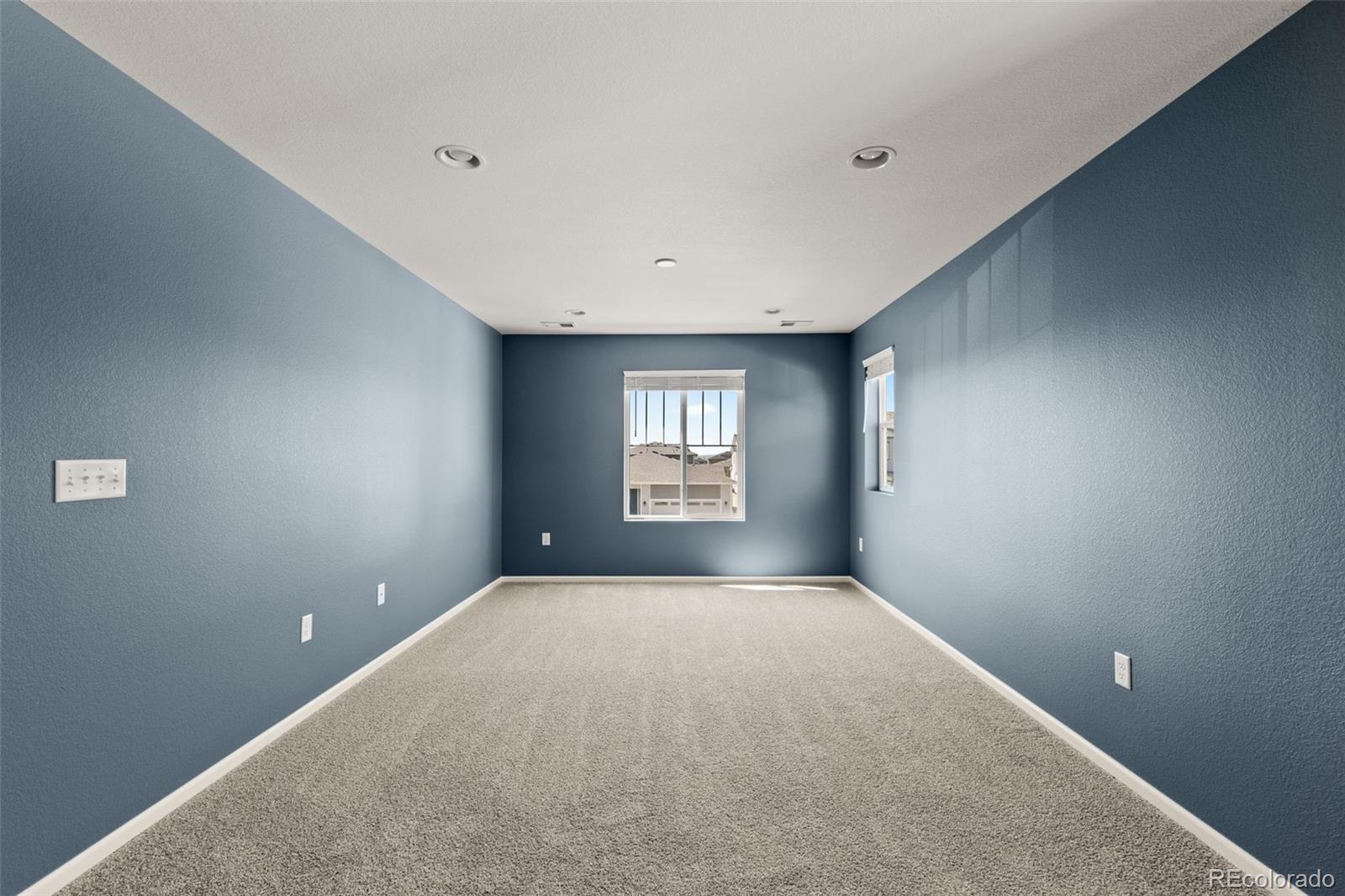 9054 Truckee Court Commerce City, CO 80022 - Photo 35 of 49 a view of an empty room with a window