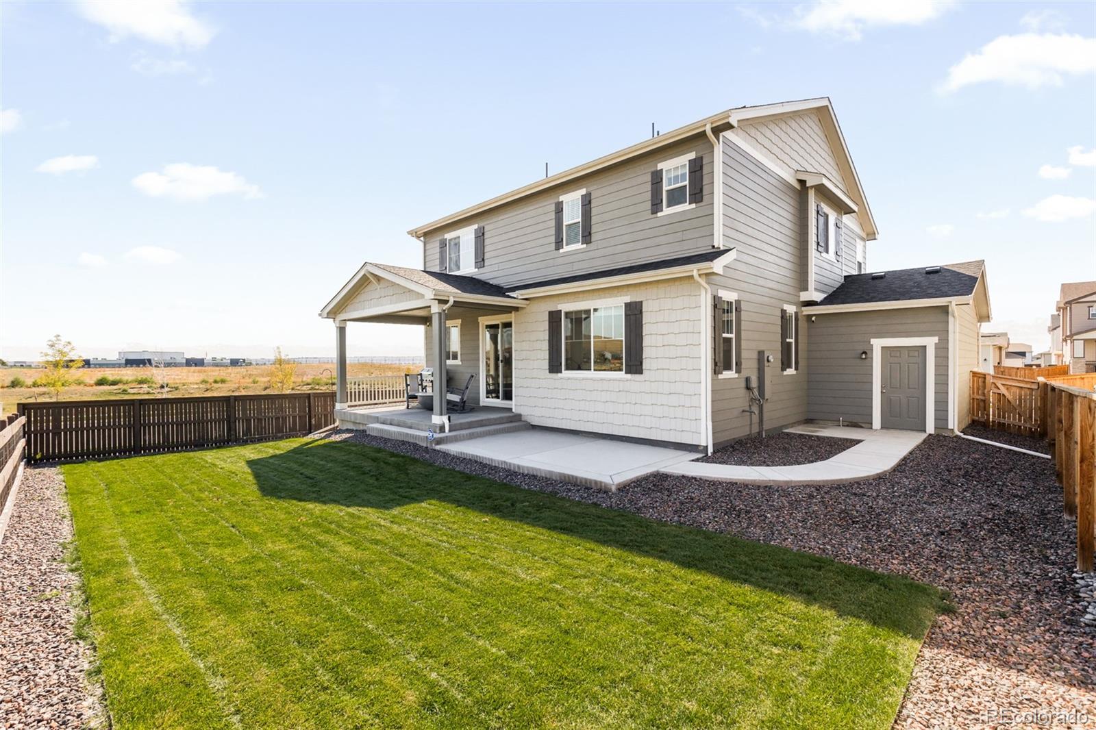 9054 Truckee Court Commerce City, CO 80022 - Photo 41 of 49 a front view of a house with swimming pool having outdoor seating