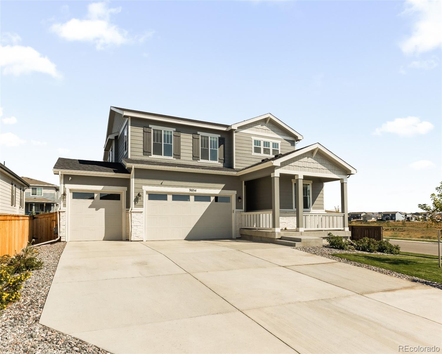 9054 Truckee Court Commerce City, CO 80022 - Photo 46 of 49 a front view of a house with a yard