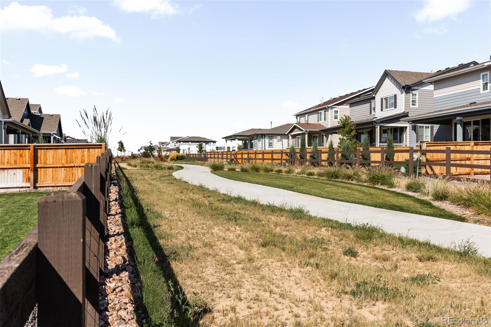 9054 Truckee Court Commerce City, CO 80022 - Photo 47 of 49 a view of a house with roof deck