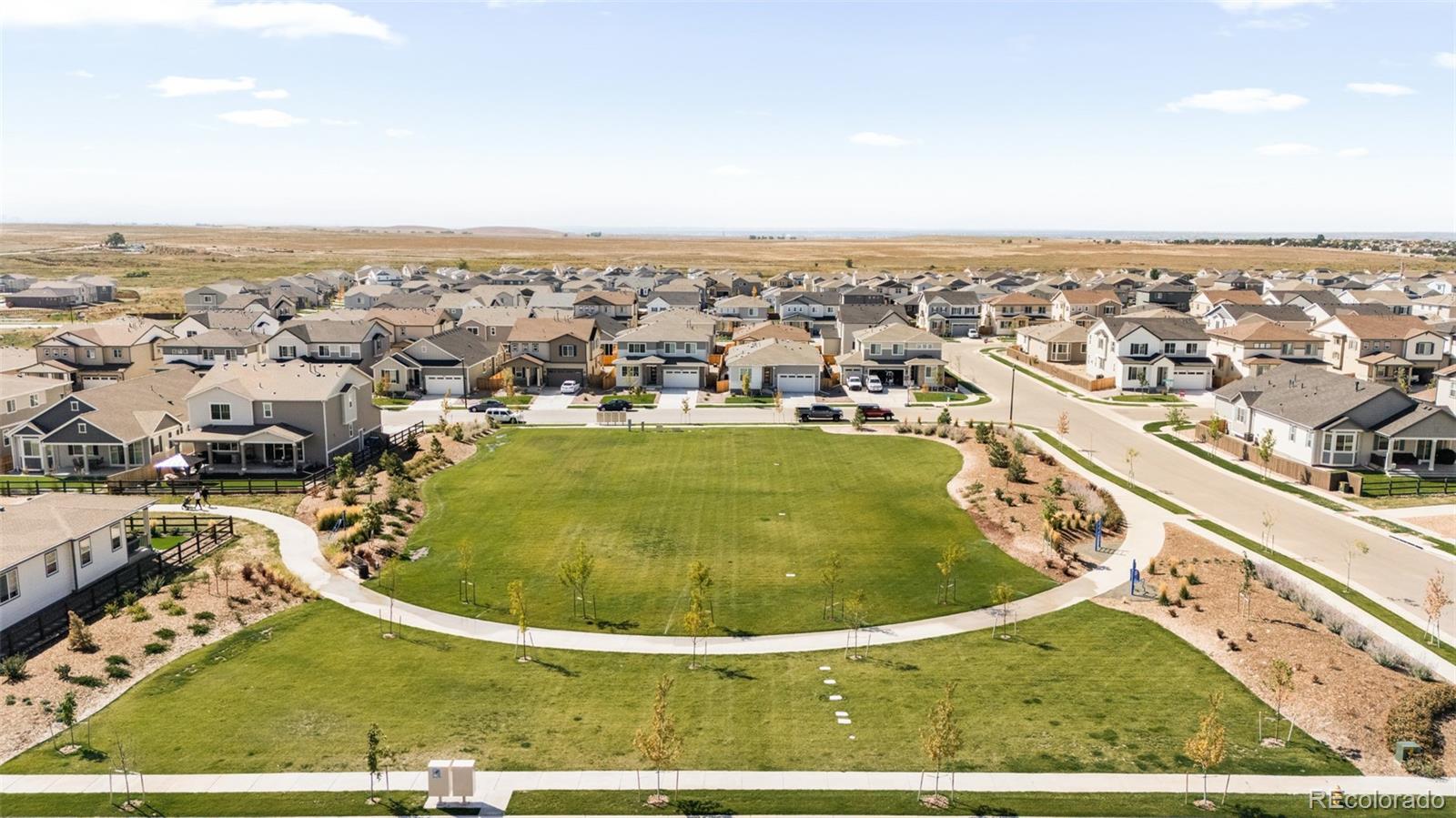 9054 Truckee Court Commerce City, CO 80022 - Photo 48 of 49 an aerial view of residential houses with outdoor space