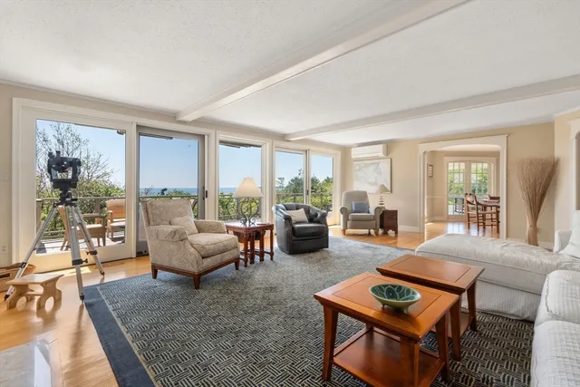 a view of a roof deck with furniture