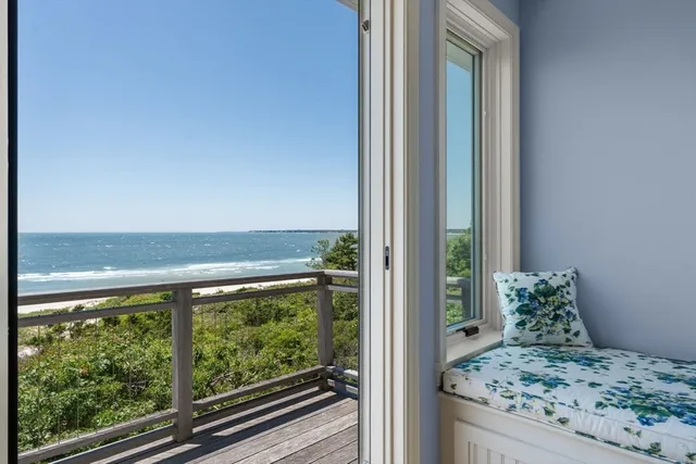 a view of a balcony with an ocean view