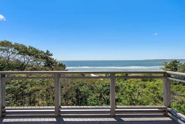 a kitchen with granite countertop a sink appliances and cabinets