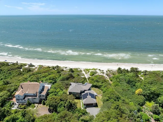 a view of a beach with a mountain