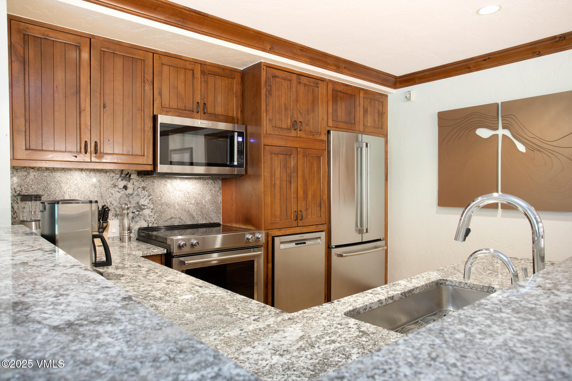 100 Bachelor Ridge Road, Unit 3214 Avon, CO 81620 - Photo 8 of 58 a kitchen with granite countertop a refrigerator and a sink
