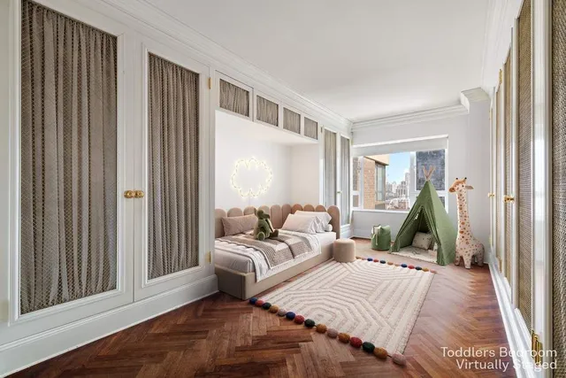 a bedroom with two beds and a large window