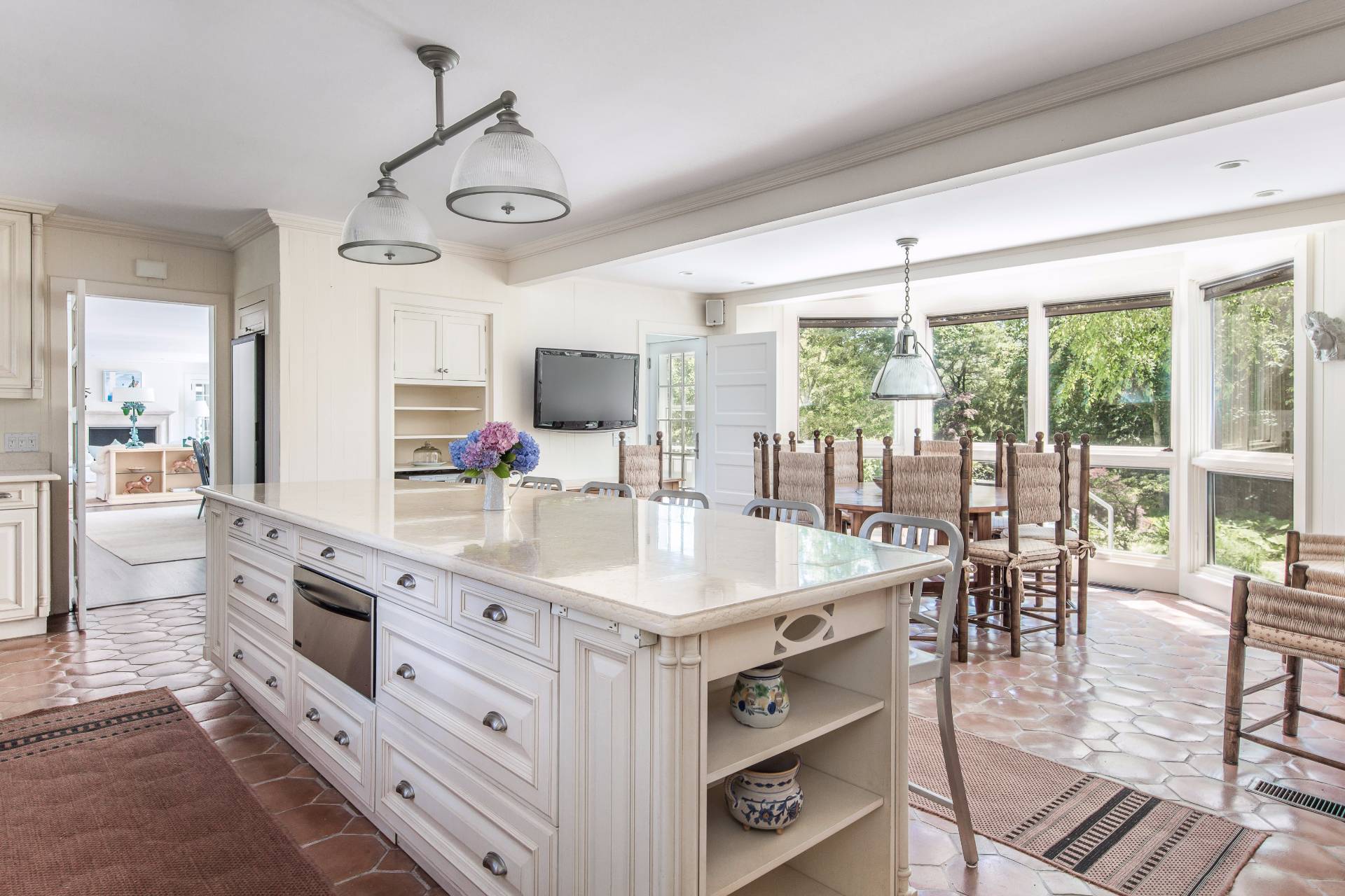 86 Georgica Road East Hampton, NY 11937 - Photo 11 of 20 a kitchen with stainless steel appliances granite countertop a stove and cabinets