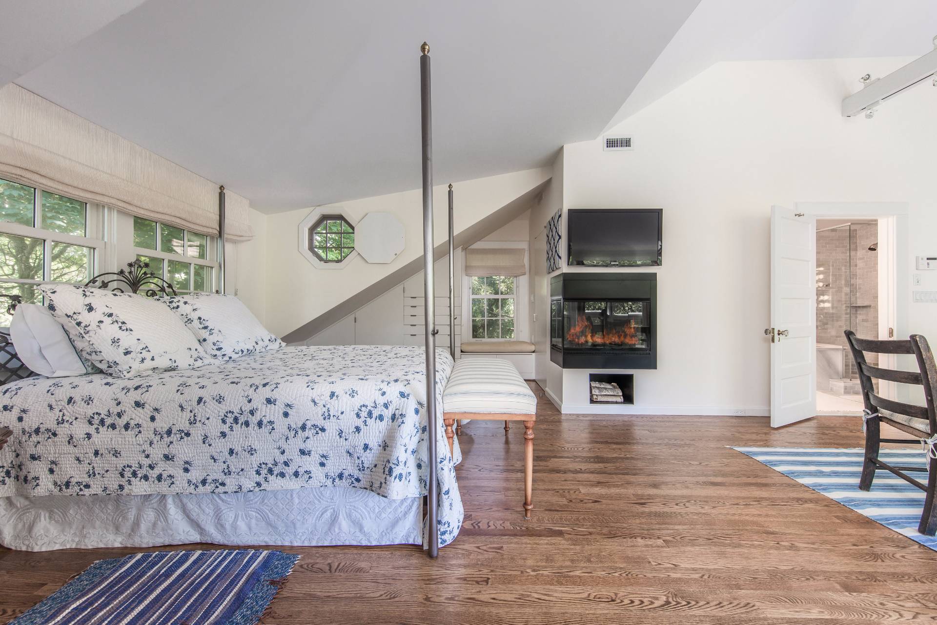 86 Georgica Road East Hampton, NY 11937 - Photo 14 of 20 a living room with furniture flat screen tv and a fireplace