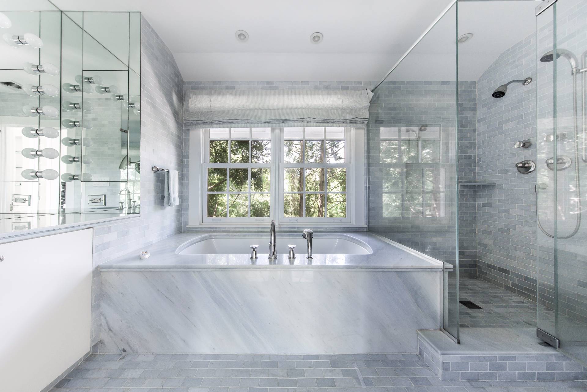 86 Georgica Road East Hampton, NY 11937 - Photo 15 of 20 a dining room with a large window and chandelier