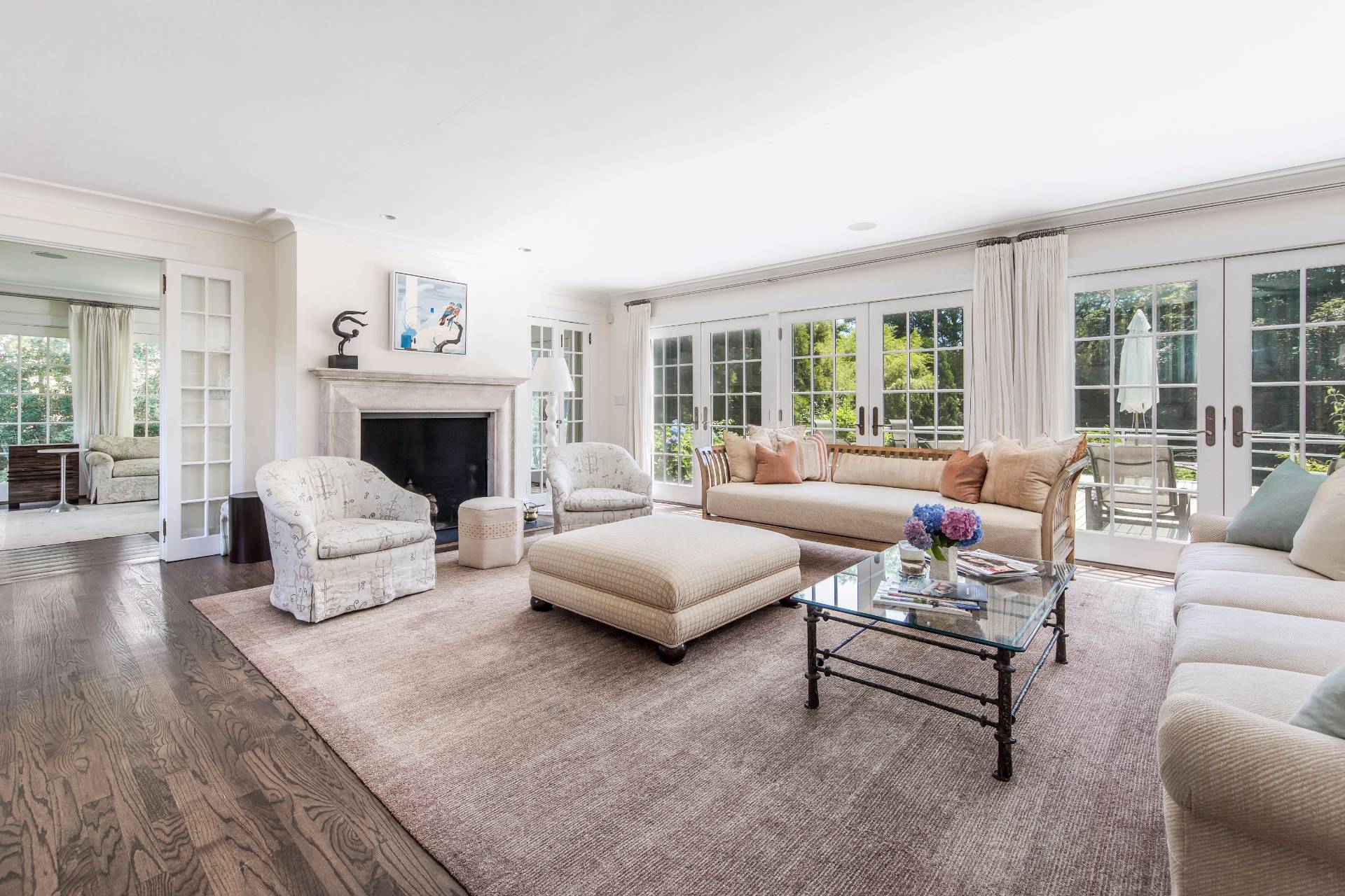 86 Georgica Road East Hampton, NY 11937 - Photo 5 of 20 a living room with furniture and a fireplace