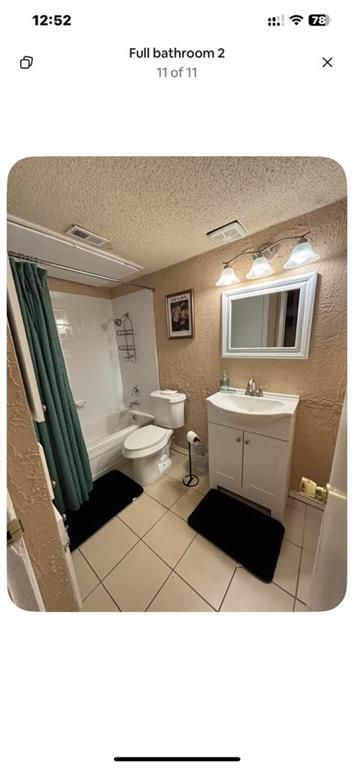 5615 Harvest Hill Road, Unit 2015 Dallas, TX 75230 - Photo 6 of 9 a bathroom with a sink a toilet and a mirror
