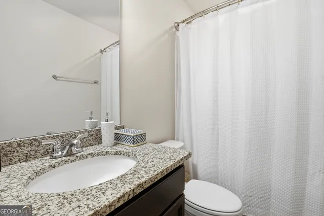 a view of big yard with a house in the background