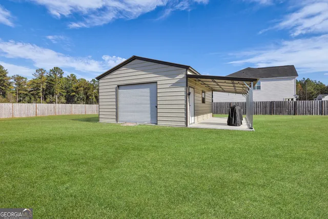 a view of a house with backyard and deck