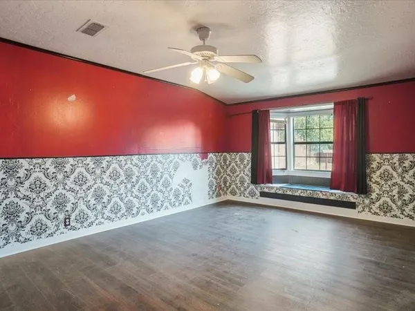 a view of an empty room and window