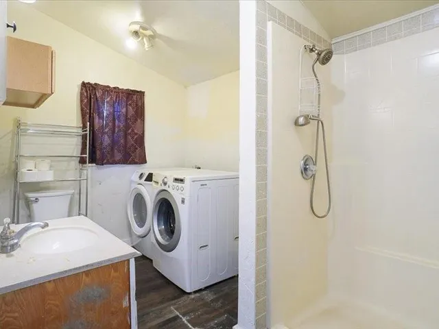 a utility room with dryer and washer