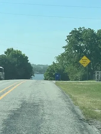 a view of a field with an trees