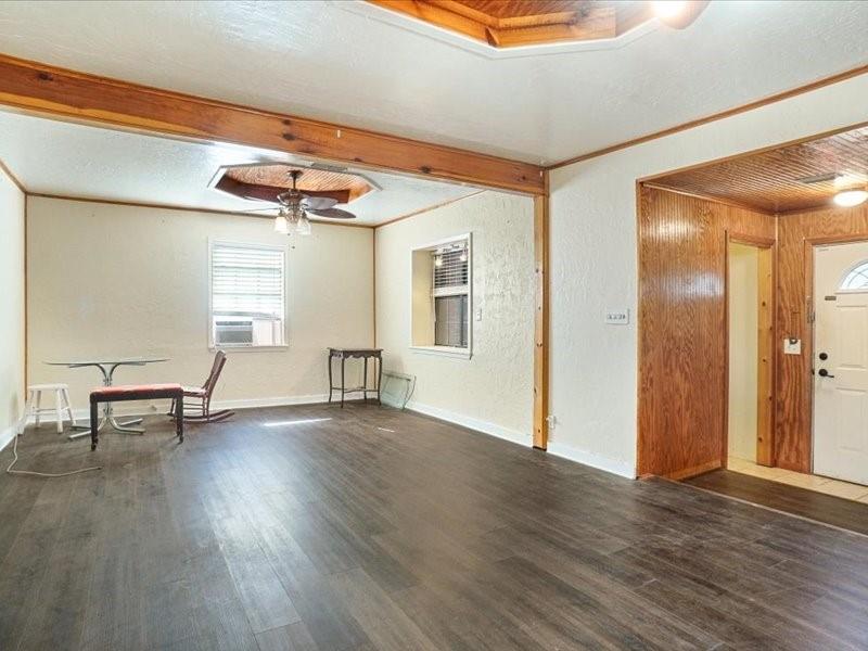 33 Park Lane Gainesville, TX 76240 - Photo 4 of 22 a view of an empty room with wooden floor and a window
