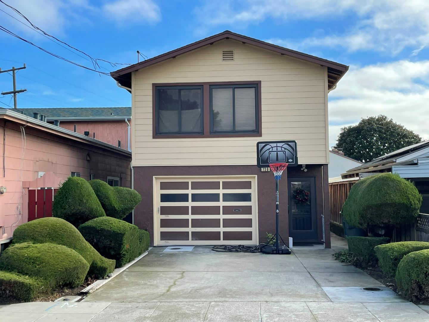 a front view of a house with garage