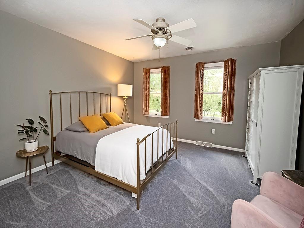 164 Robinson Run Road Butler, PA 16002 - Photo 13 of 25 a bedroom with a bed and a chandelier