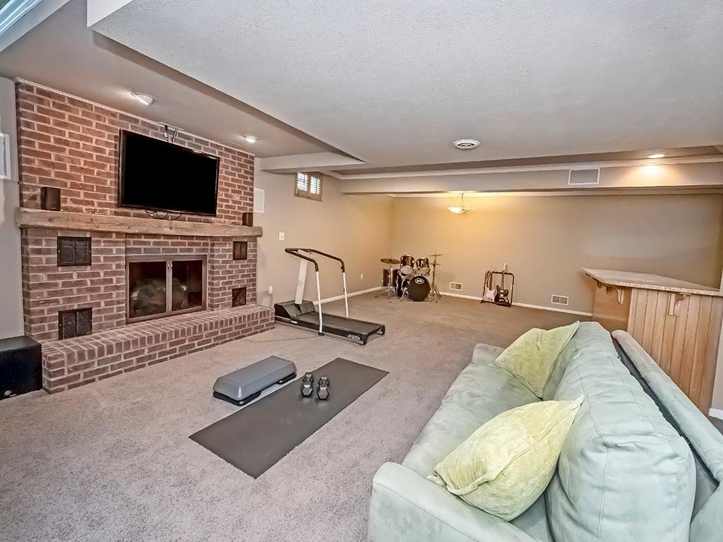 164 Robinson Run Road Butler, PA 16002 - Photo 15 of 25 a living room with furniture and a flat screen tv