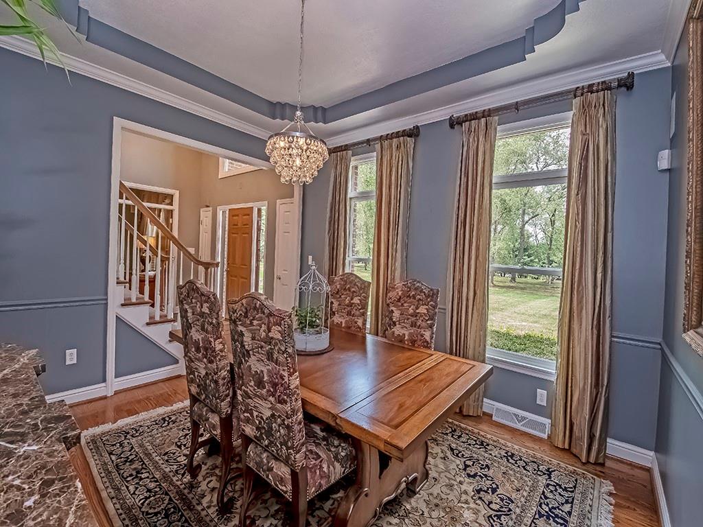 164 Robinson Run Road Butler, PA 16002 - Photo 5 of 25 a view of a dining room with furniture window and wooden floor