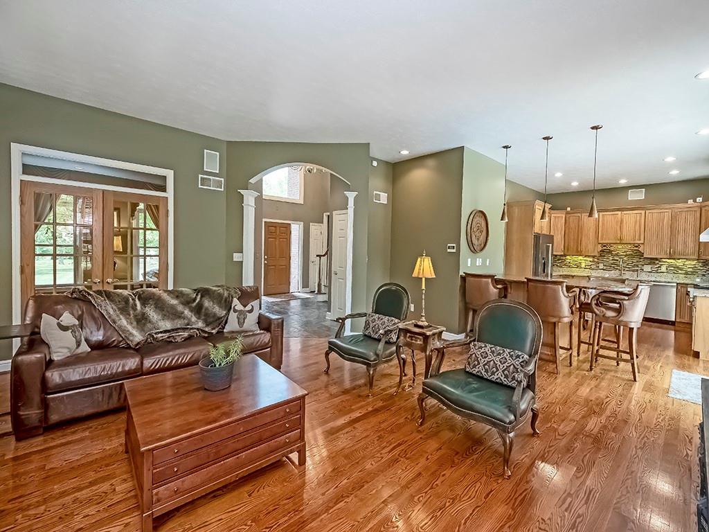 164 Robinson Run Road Butler, PA 16002 - Photo 6 of 25 a living room with furniture kitchen view and a wooden floor