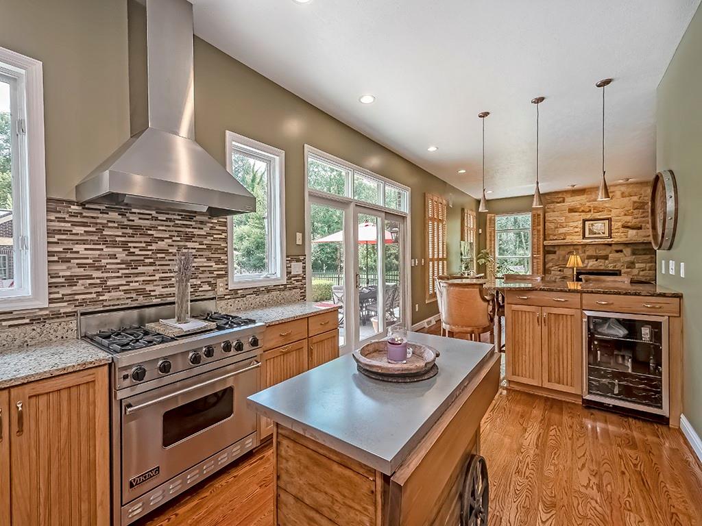 164 Robinson Run Road Butler, PA 16002 - Photo 8 of 25 a kitchen with a stove a sink and a refrigerator