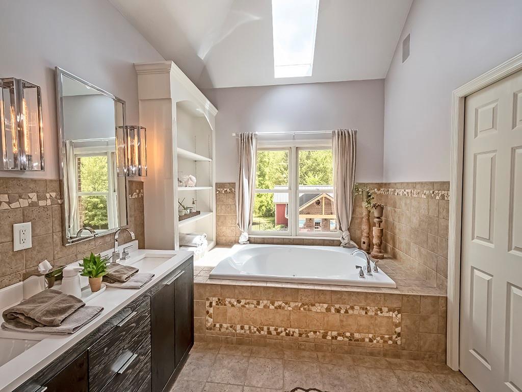 164 Robinson Run Road Butler, PA 16002 - Photo 10 of 25 a spacious bathroom with a tub sink and mirror