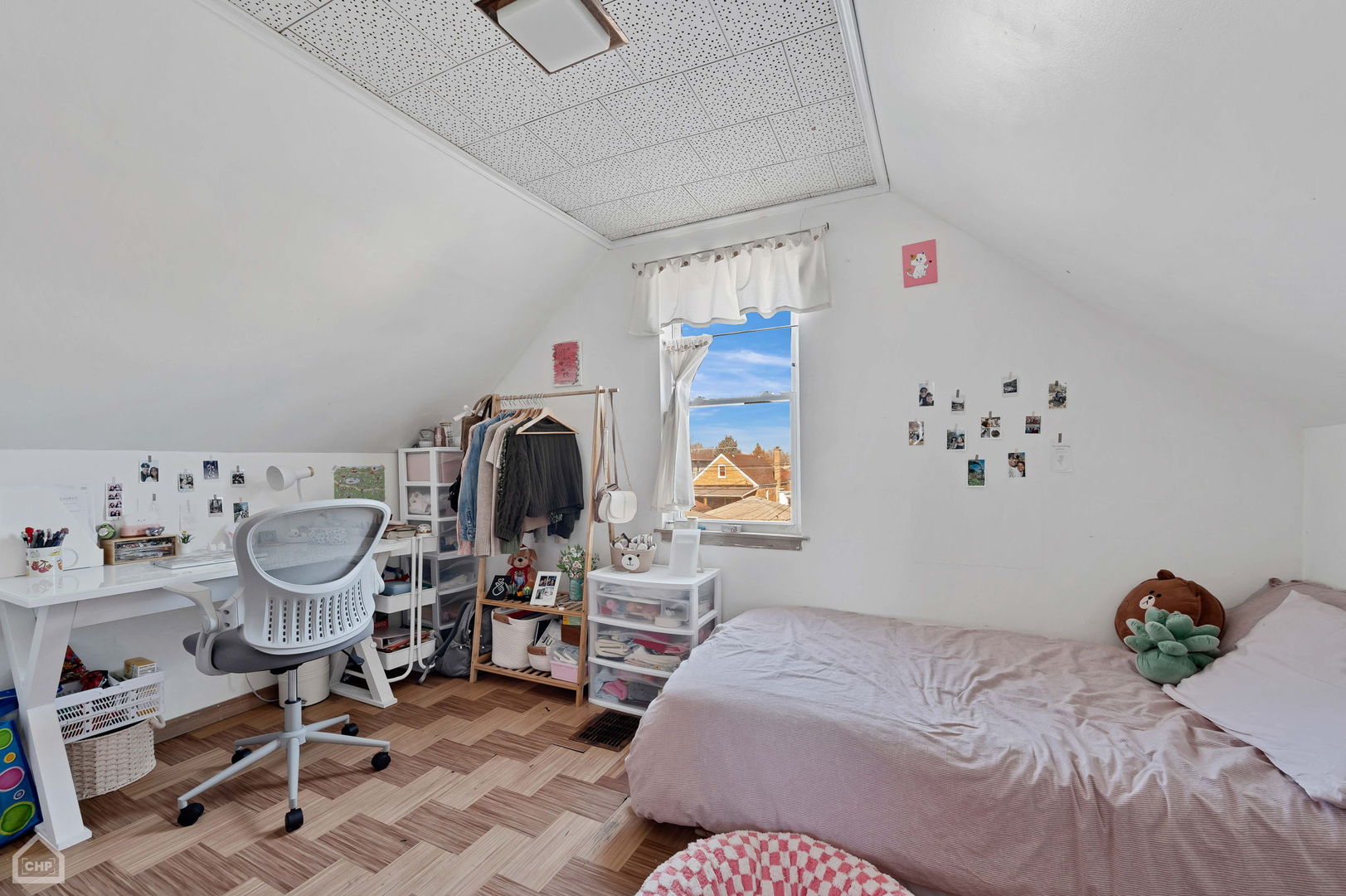 3736 West 70th Street Chicago, IL 60629 - Photo 14 of 21 a bedroom with a bed and a chandelier