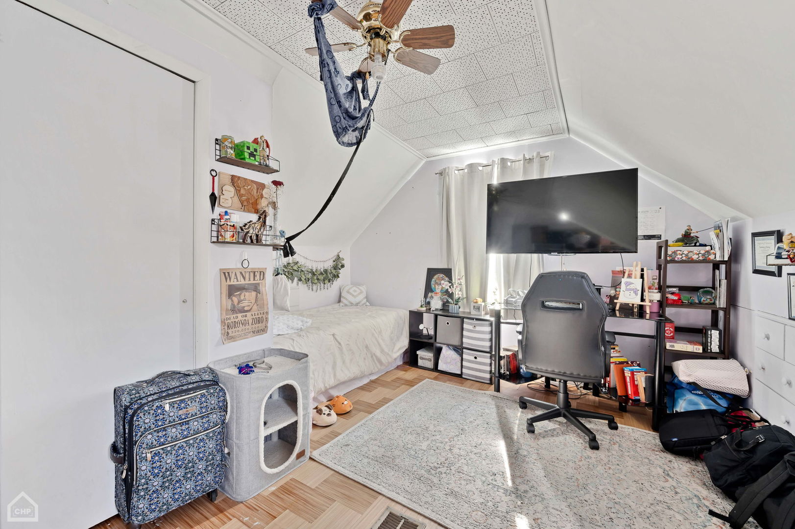 3736 West 70th Street Chicago, IL 60629 - Photo 17 of 21 a bedroom with furniture and a flat screen tv